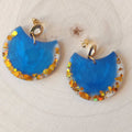 Croissants bleus et paillettes orange